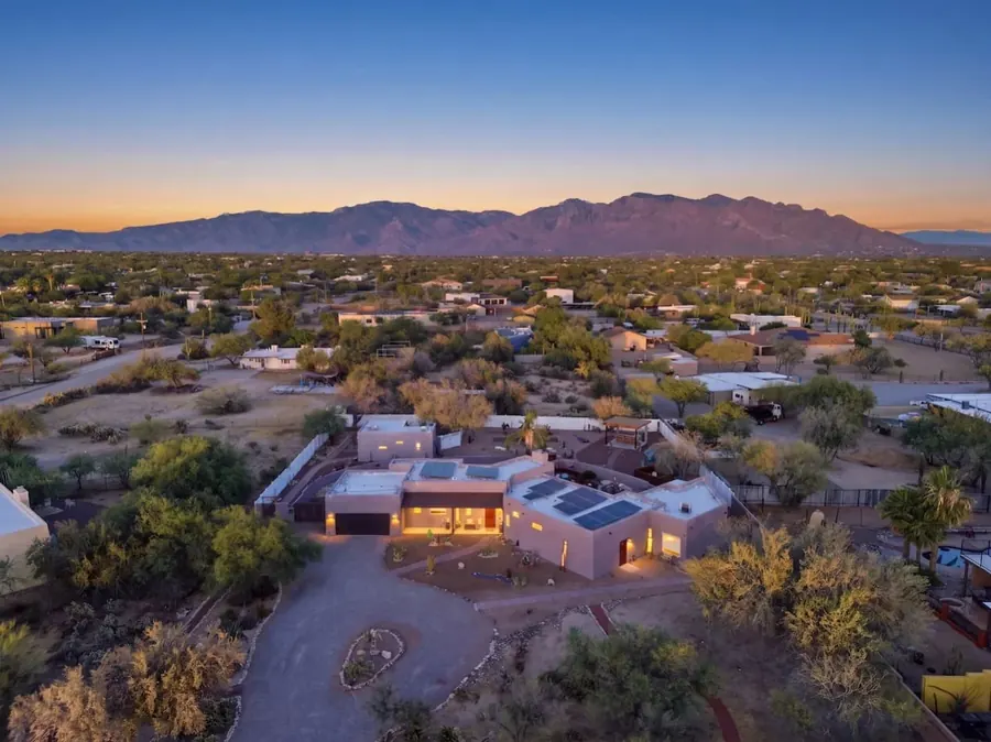 Aerial home view with mountains, desert trees and courtyard